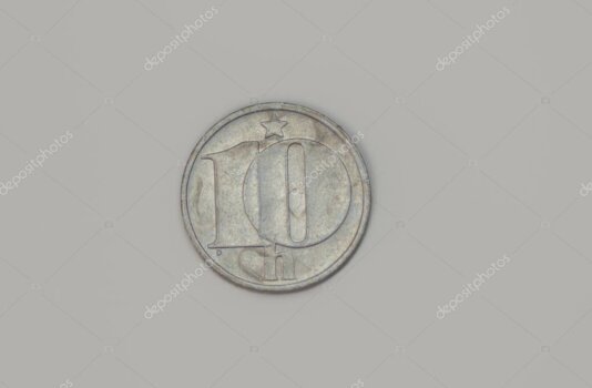 Primo piano di una medaglia ufficiale dei Giochi di Torino 2006 che mette in risalto i rilievi